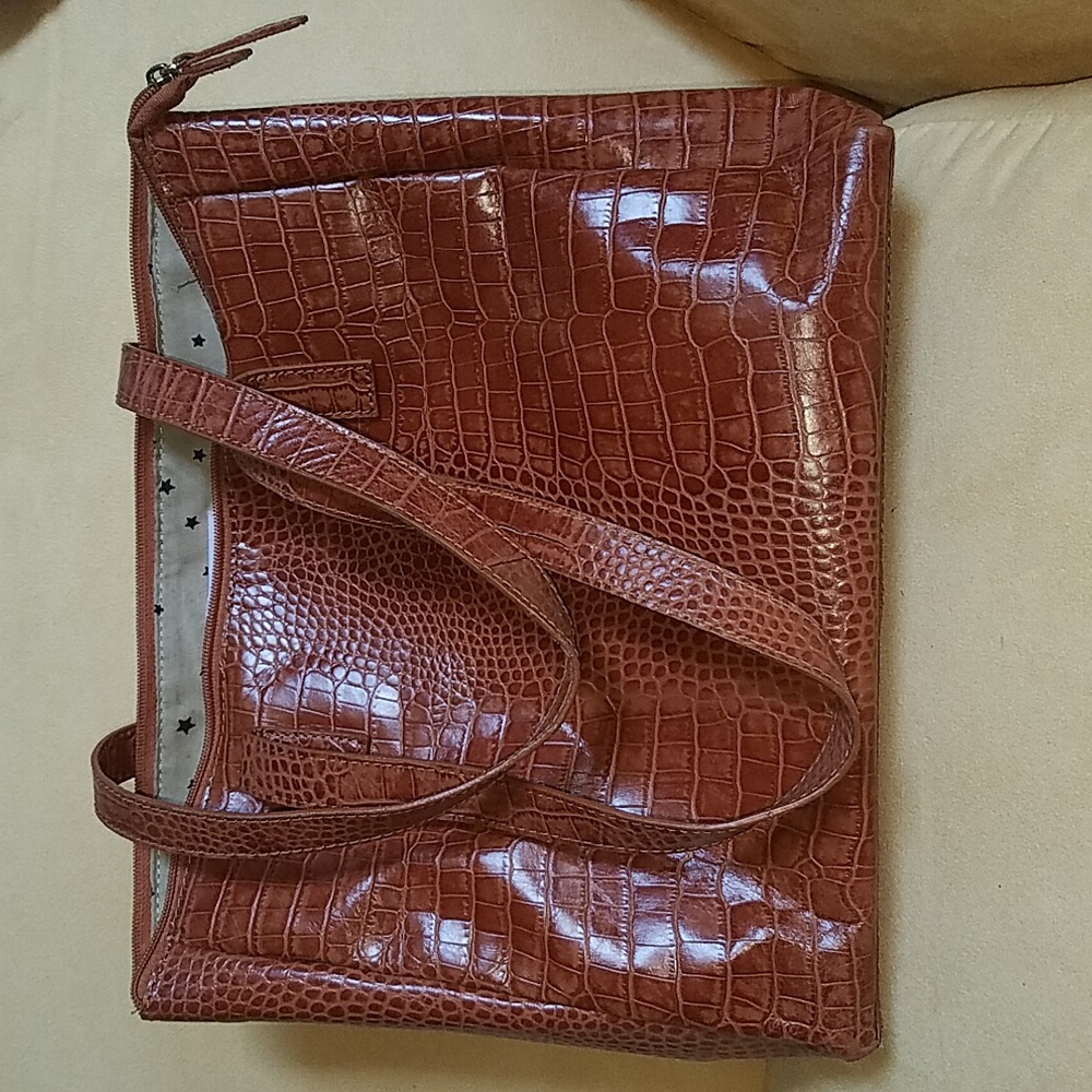 Passages tan snake print tote and wristlet.